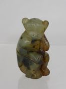 A Carved Hard Stone Figure of a Monkey, possibly jade approx ht 7 cms.