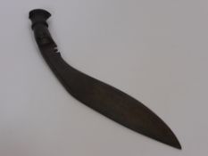 A WW1 Army Issue Kukri. The Kukri has its original wooden grip and the blade is marked with a