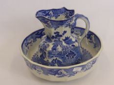 A Willow Pattern Masons Water Jug and Bowl, the jug having a handle in the form of a serpent.