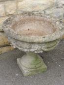 A Stone Composite Garden Planter on Stand, together with a classical style plant pot. (2)