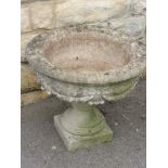 A Stone Composite Garden Planter on Stand, together with a classical style plant pot. (2)