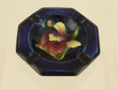 A Moorcroft Ashtray, depicting an Orchid, with marks to base.