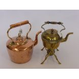 An Antique Copper Fireside Kettle, together with a brass spirit kettle and stand. (2)