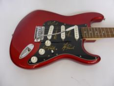 A Fender Stratocaster Squier Electric Guitar, hand signed by Eric Clapton, Ginger Baker and three