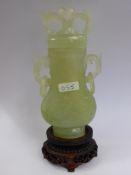 Chinese 20th Century Pale Celadon Vase and Cover, the pear shaped vase features white inclusions and