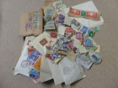 A Box of All World Stamps in Envelopes, mostly common place.