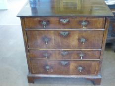 An Antique (Queen Anne) Chest of Drawers, having small and large alternate drawers with decorative