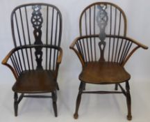 Two Antique Wheel Back Windsor Chairs, with turned legs and stretchers.