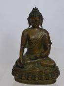 A Bronzed Seated Figure of a Buddha on wooden base, approx 30 x 20 cms.