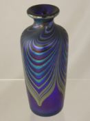 An Okra Glass Studio Vase, of baluster form with luminescent ground with blue feathered design,