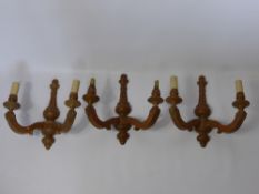 Three Fruit Wood Twin Branch Wall Sconces, approx 34 x 33 cms together with a Four Branch Limed