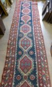 An Antique Turkish Style Woollen Hall Runner, blue/red/cream,