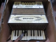 Two Concertinas, a Mayfair Concertina in the original box, together with a Hohner Student 1. (2)