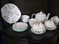 A Part Minton Haddon Hall Tea Set, comprising tea pot, sandwich plate, six tea plates, six cups, six