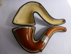 An Antique Sherlock Holmes-style Meerschaum Pipe, silver rim to bowl and stem with amber mouthpiece,