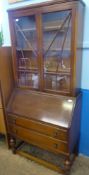 A Mahogany Bureau Bookcase, with glazed doors, three internal shelves, seven cavities and a single