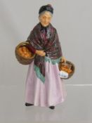 An Early Doulton Figurine of "The Orange Lady", approx 21 cms high.