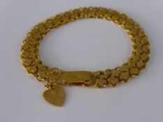 A Lady's 21 ct Yellow Gold Design Link Bracelet, with safety clasp and charm approx wt 18 gms,