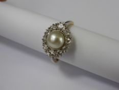 A Lady's 18ct Yellow and White Gold Diamond and Pearl Ring. The ring set with ten graduated diamonds