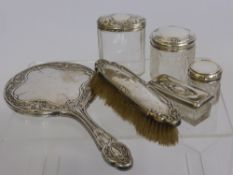 Four Silver Topped Cut Glass Perfume Bottles London and Birmingham hallmarks, together with a silver