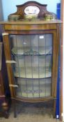 An Edwardian Mahogany Inlaid Bow Fronted Display Cabinet having a stained leaded glass door and