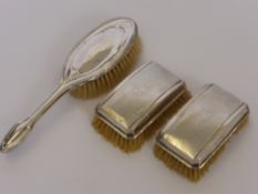 A Pair of Silver Gentleman's Brushes, Birmingham hallmark dd 1935/36 together with a silver