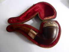 An Antique Pipe with Embossed Gold-metal rim to bowl and stem with amber mouthpiece, approx 11