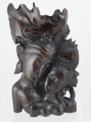 A Rosewood Carving of a Balinese couple embracing, stamp to base, approx 36 cms high.