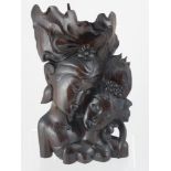 A Rosewood Carving of a Balinese couple embracing, stamp to base, approx 36 cms high.