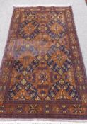 An Antique Turkish Style Woollen Carpet, geometric design in royal blue, brown and cream, approx 117