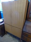 Gordon Russell of Broadway teak wardrobe with shelves to the interior, approx 92 x 62 x 40 cms.