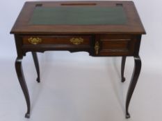 A Lady's Writing Desk with single drawer and stationary cupboard to one side and green leather