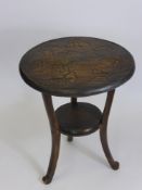 An Antique Oak Occasional Table, on tripod base with the top hand carved with butterflies.