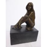 A Bronzed Figure of a Girl with long flowing hair seated on marble plinth, approx 24 x 17 x 11 cms.