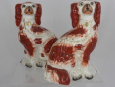 A Pair of Porcelain Circa 1900 Staffordshire Style Dogs, approx 25 cms high.