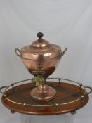 A Copper and Brass Samovar, together with an Arts & Crafts oak and brass oval tray with a decorative