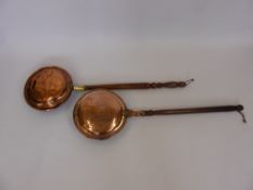 Two Copper Bed Warmers, both with turned handles.