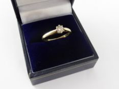 An 18 ct Gold Lady's Diamond Solitaire Ring, size M, appro 1.6 gms.