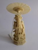 An Antique Chinese Carved Ivory Chess Piece of Emperor on octagonal plinth with ceremonial raised