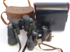 A Pair of Binoculars in Cases, one marked Negretti & Zambra, the other Scheffel 10 x 50 field 5.5