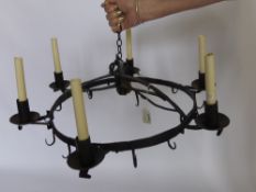 An Antique Cast Iron Six Branch Game Crown, with six game hooks, converted for electricity.