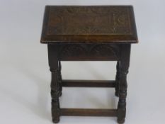 An Antique Oak Sewing Box on turned legs with straight stretchers with decorative fan carving to