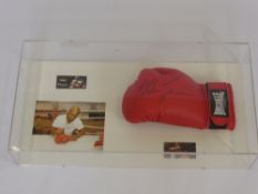 A Mike Tyson Heavy Weight Champion Longsdale Boxing Glove signed Mike Tyson. The boxing glove