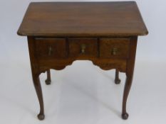 An Antique Walnut Fronted Low Boy, on cabriole legs with three drawers above a shaped frieze, approx