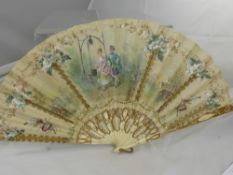 An Antique Marriage Fan, the fan depicting a couple beside a well, having applied gold wire with