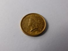 A Solid Gold United States of America 1 Dollar Coin, dated 1852. (fc)