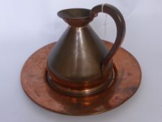 An Antique French Battle Axe, together with a copper gallon jug and a copper Union platter. (3)