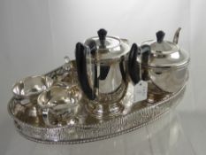 A Silver Plated Tea Set, comprising tea pot, hot water jug, milk jug and sugar bowl presented on