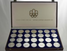 A Boxed 1976 Montreal Olympiad Presentation Silver Proof Set, containing 28 coins, approx 1050 gms