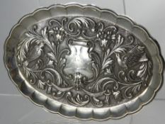 An Antique Continental Silver Ring Tray, embossed with doves amongst flowers, with lion mask below